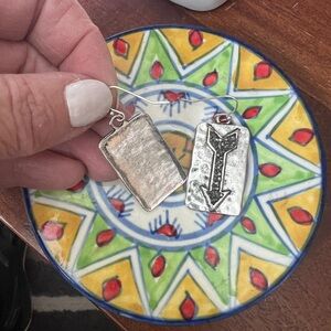 Crystal and silver arrow earrings.